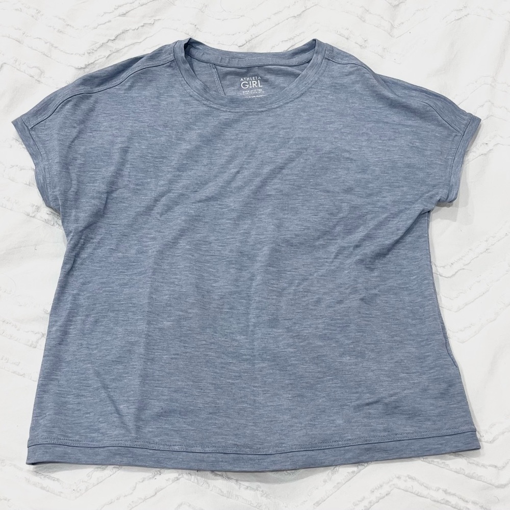 Light blue Athleta Girl, Back at it Tee. Only been worn a few times.